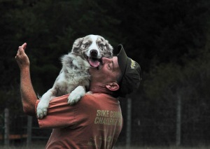 An excited Fred leaps into West's arms after a successful herding exercise.