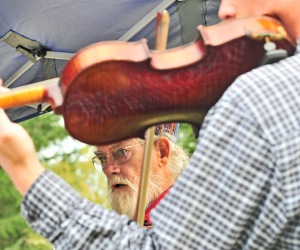 Bill Lloyd performs with local group Bluegrass Minstrels in serenading the crowd at Blue Willow Lavender Farm.